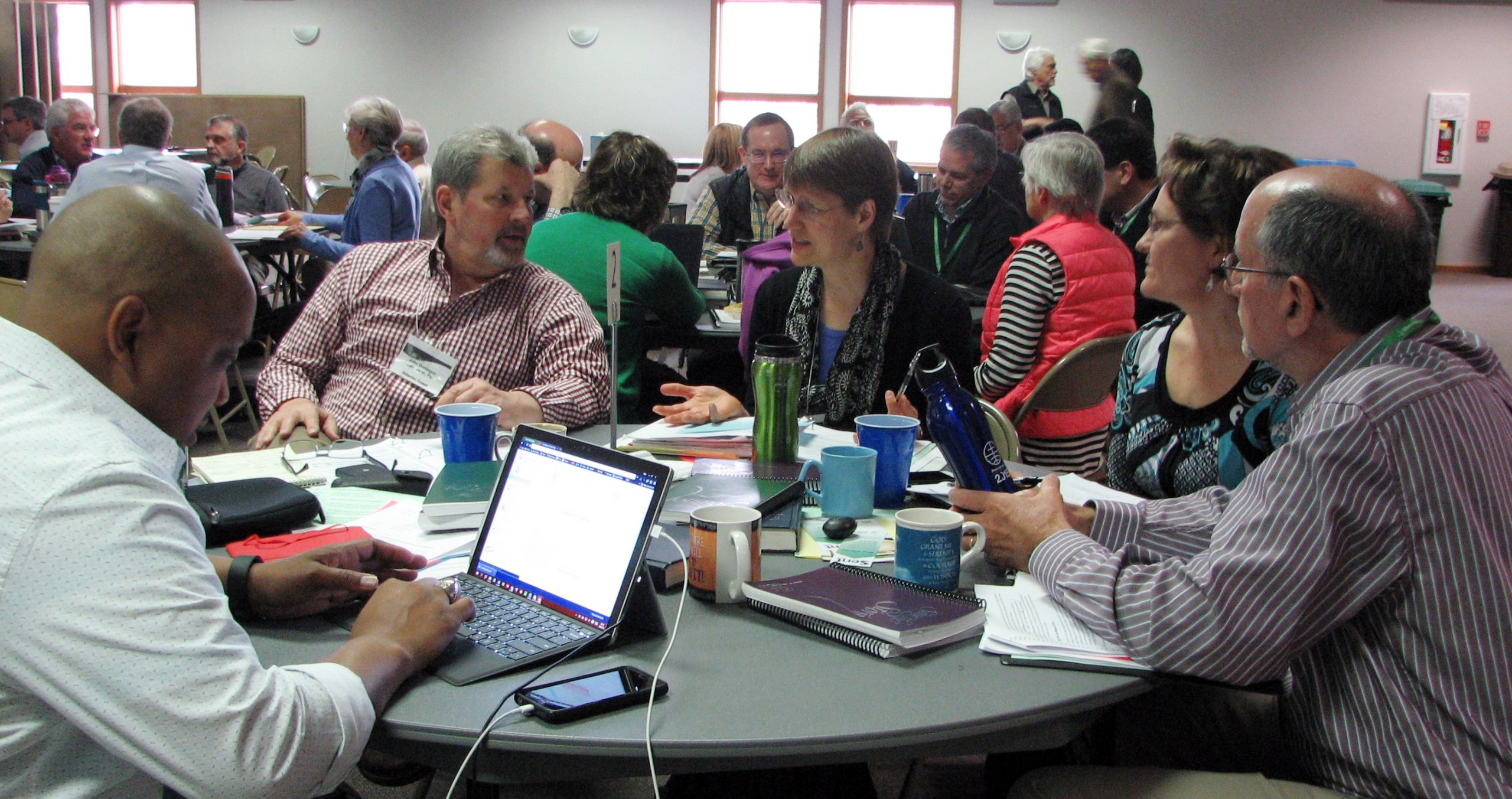 (l. to r.) Glen Guyton, chief operating officer for Mennonite Church USA; John Denlinger, representing Atlantic Coast Conference; Heidi Regier Kreider, representing Western District Conference; Shana Peachey Boshart, representing Central Plains Mennonite conference; and Howard Good, representing the 14 Lancaster Mennonite Conference congregations who want to remain connected with Mennonite Church USA; at the March Constituency Leaders Council meeting at Silverwood Mennonite Church in Goshen, Indiana. (Photo by Annette Brill Bergstresser)