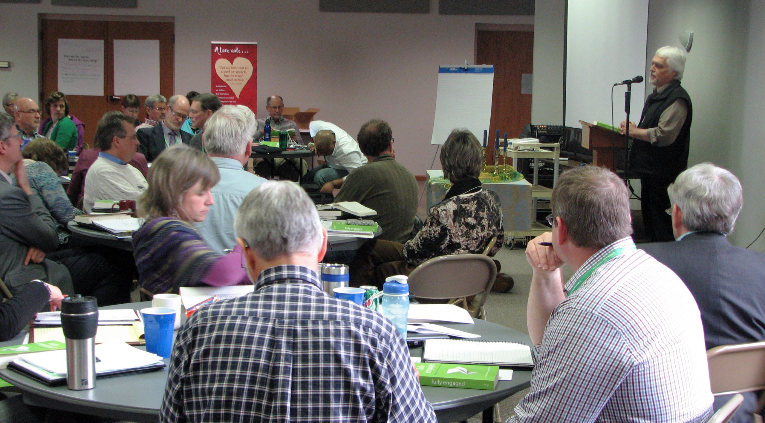 James Krabill, senior executive for Global Ministries for Mennonite Mission Network, presents an overview of Fully Engaged: Missional Church in an Anabaptist Voice, a new book he has co-edited with Stanley Green, executive director for Mission Network, at the March Constituency Leaders Council meeting at Silverwood Mennonite Church in Goshen, Indiana. (Photo by Annette Brill Bergstresser)