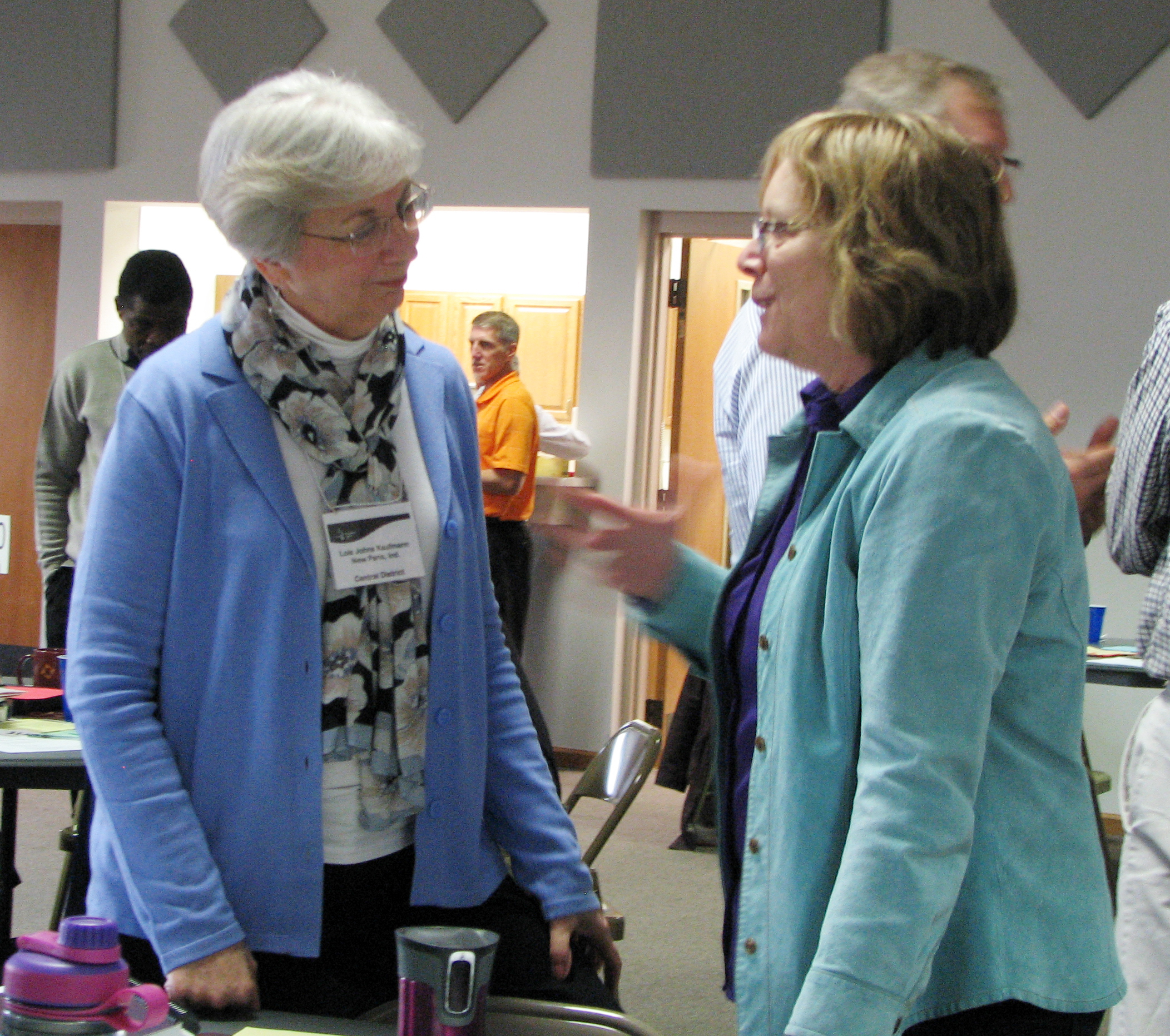 Lois Johns Kaufmann, conference minister for Central District Conference, talks with Nancy Kauffmann, denominational minister for Mennonite Church USA, at the March Constituency Leaders Council meeting at Silverwood Mennonite Church in Goshen, Indiana. At the meeting, Johns Kaufmann was honored for her years of ministry. She plans to retire this summer. (Photo by Annette Brill Bergstresser)