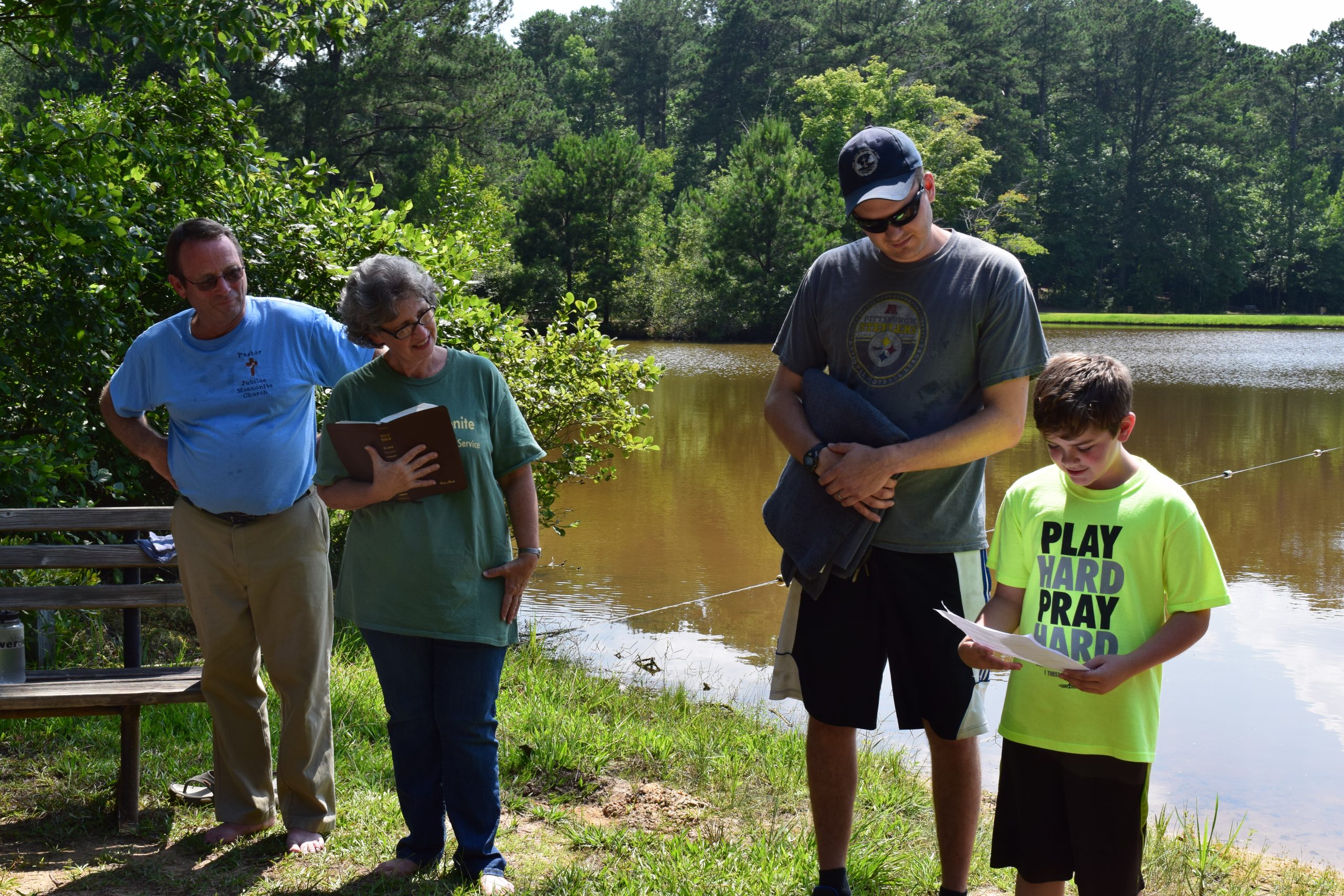 Jubilee Mennonite Church provides leadership at Pine Lake Fellowship Camp in Meridian, Mississippi. Pastors Duane and Elaine Maust look on as Noah Chisolm prepares for baptism with his mentor, Matt Graybill. (Photo provided by Laurie Oswald Robinson)