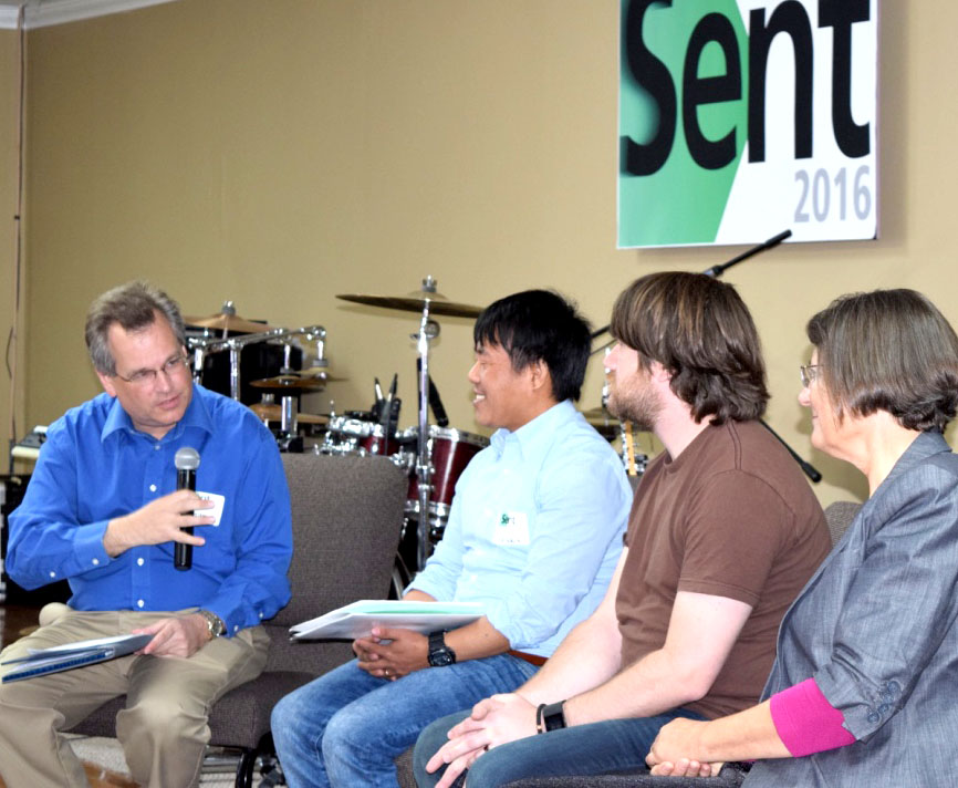 Olak Sunuwar, from Chicago, Illinois (second from left), and Matthew Pritchard, from Pittsburgh, Pennsylvania (second from right), respond to AMBS president Sara Wenger Shenk’s sharing on a discussion panel led by David Boshart, Central Plains Mennonite Conference minister. (Photo by Ken Gingerich of Mennonite Church USA)