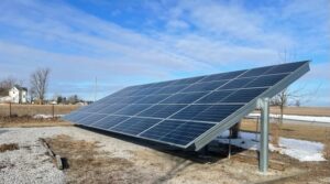 Image of Metamora Mennonite's solar panel. The panel is attached directly to the ground in an open area.