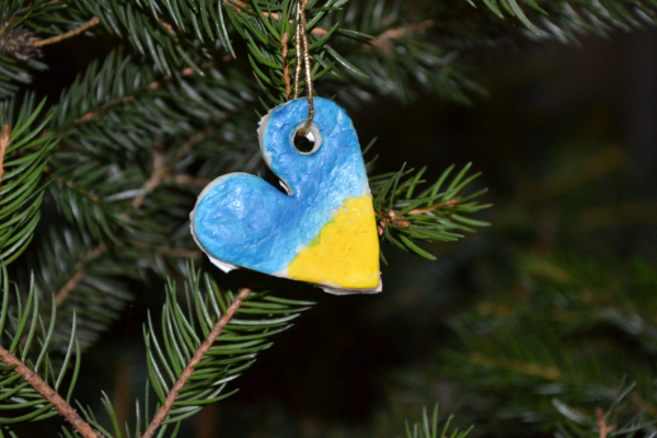 Heart-shaped Christmas ornament painted blue and yellow