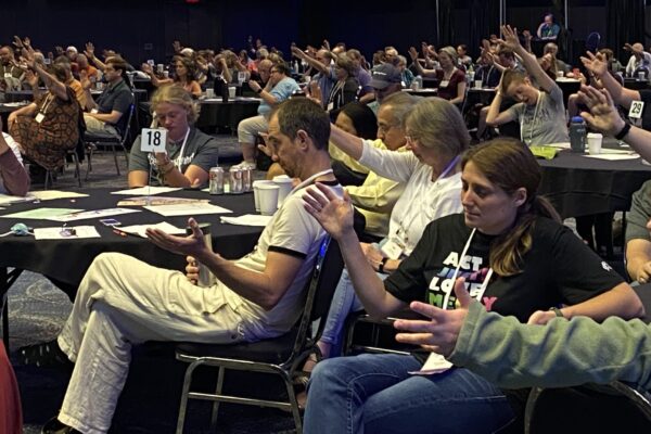 Delegate Assembly 2023 praying.