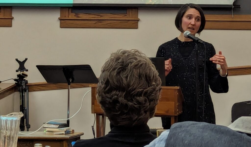 Woman speaking at a podium