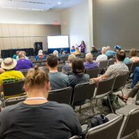MennoCon23 attendees participate in a MennoMedia-led seminar.